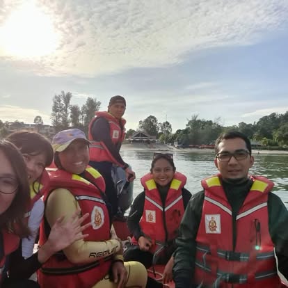 Team in life vests at sea