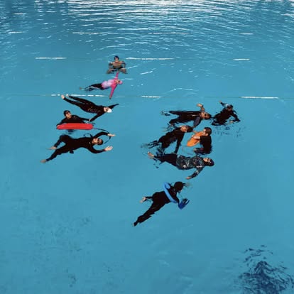 Aerial view of swimmers in a circle float drill