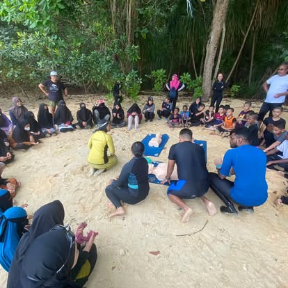 CPR training on the beach