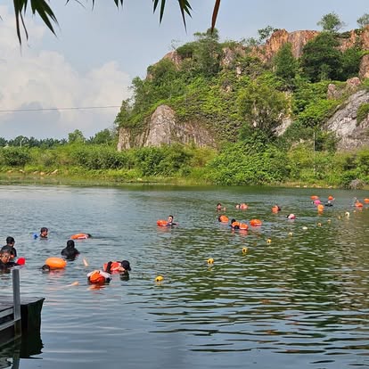 Open water swimmers in the quarry lake