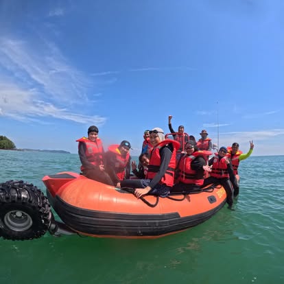 Team cheering aboard a rescue RIB boat